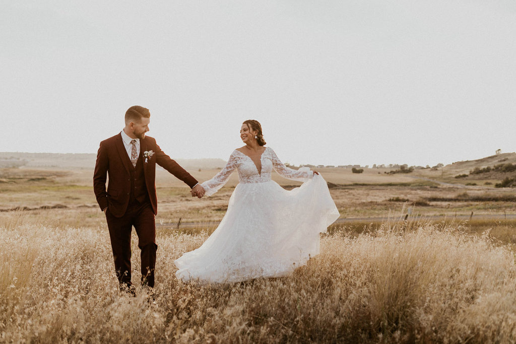 Outdoor field wedding photography at golden hour